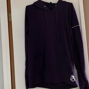 Born primitive, purple hoodie.